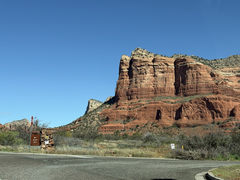 Craig Spiesman image showing Bell Rock Vista sign beside massive red sandstone cliffs
