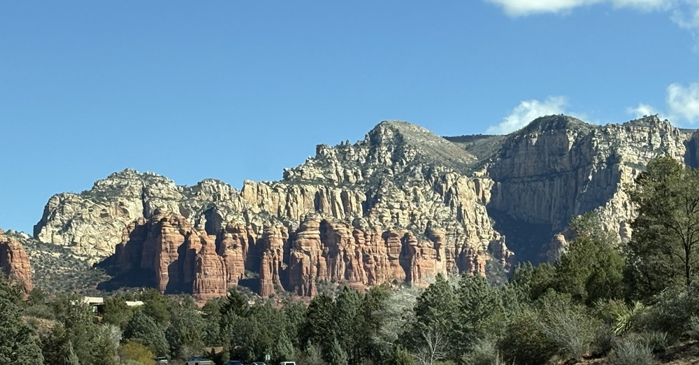 Craig Spiesman landscape with steep mountain ridges, deep valleys, and colorful rocky terrain
