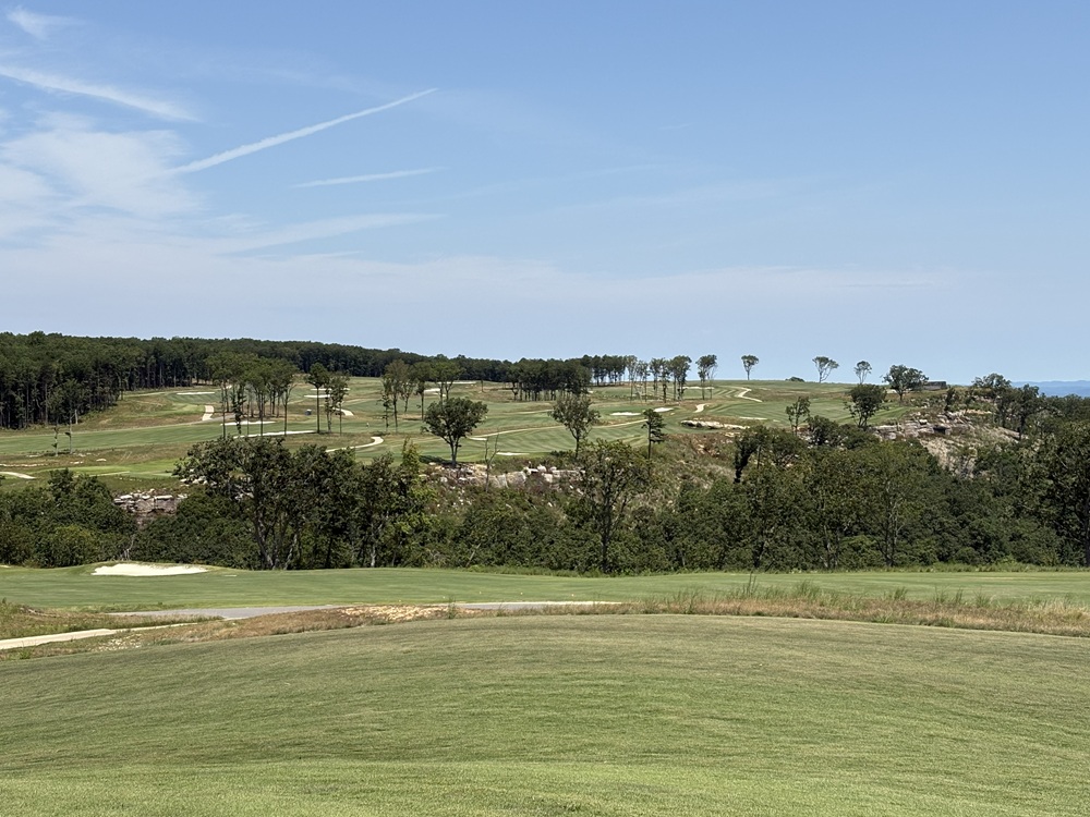Craig Spiesman image showing a panoramic golf course view with fairways and sand bunkers